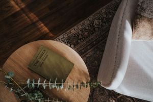 Olive book on an oak side table