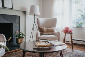 Reading corner with tripod lamp and wingback chair