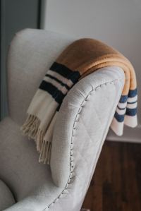 Striped throw on a quilted chair